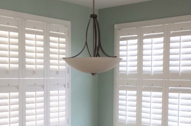 Double hung plantation shutters